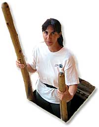 Anne climbing from kiva at Spruce Treehouse.